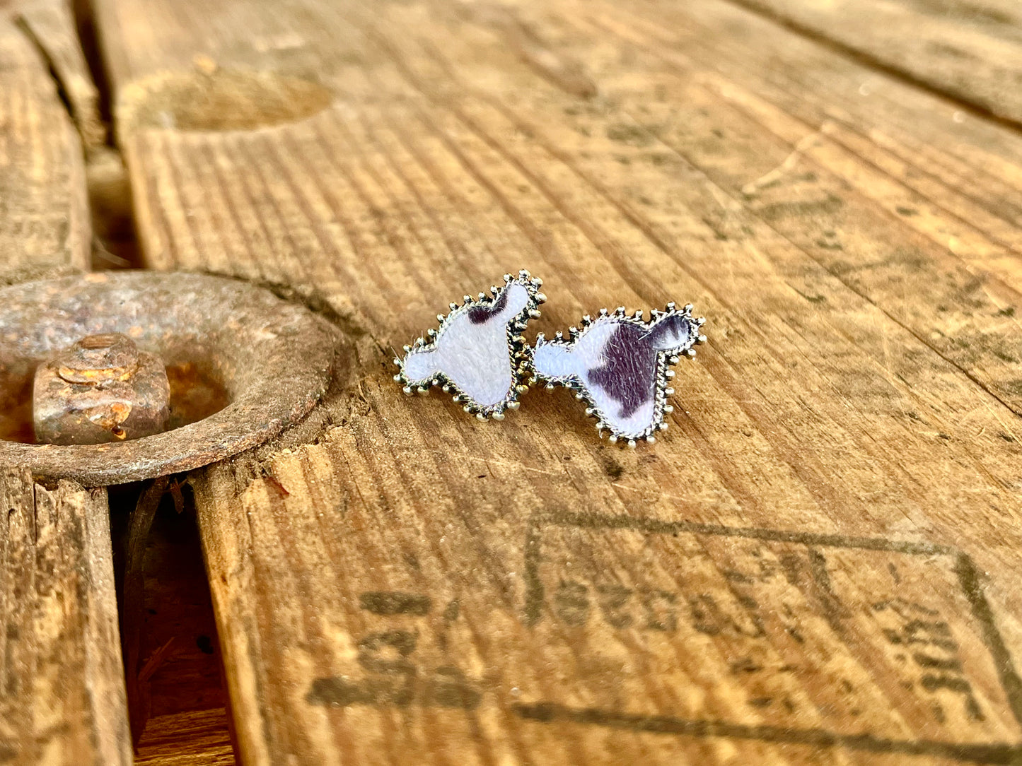 Small black & white cow studded earrings